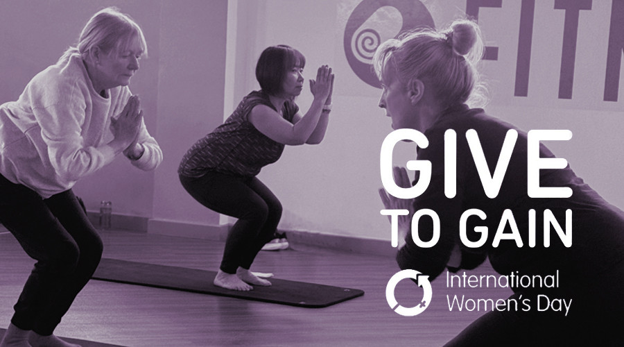 3 ladies performing yoga in prayer pose -  International Women's Day - Give to Gain