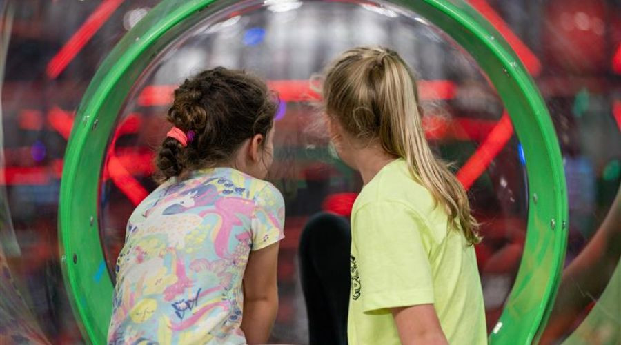 Two young girls at soft play 