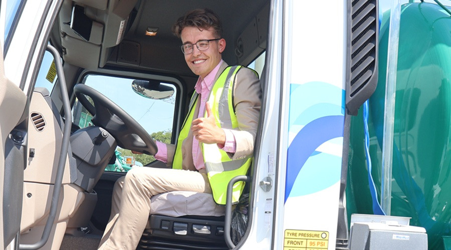 Cllr Max Booth seated in the driving seat of the cab on one of the new gully cleansing vehicles