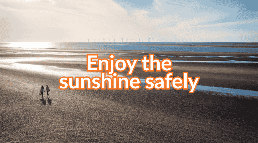 Photo of a sunny beach with the words: Enjoy the sunshine safely