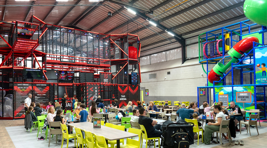 Active TAG frame and Soft Play area with cafe seating in middle of image
