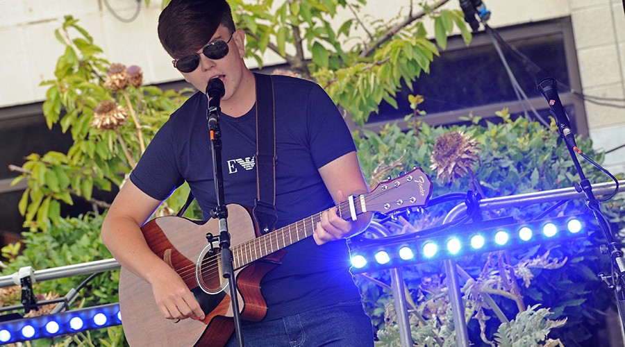 A singer performs at a previous Youth Market