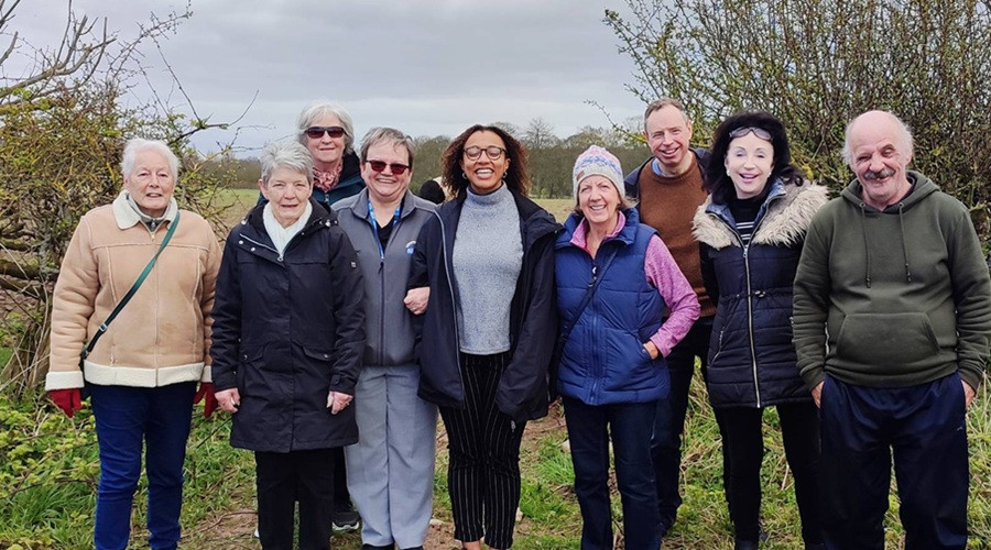 A photographs of a group of walkers taking part in an activity organised by Wirral Forest