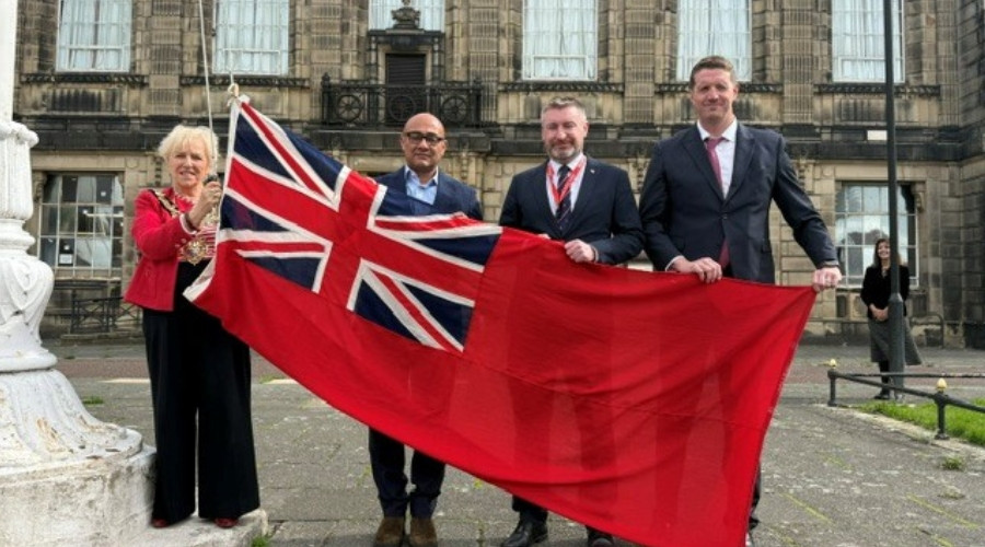 Photo of the Mayor of Wirral raising the Red Ensign outside Wallasey Town Hall