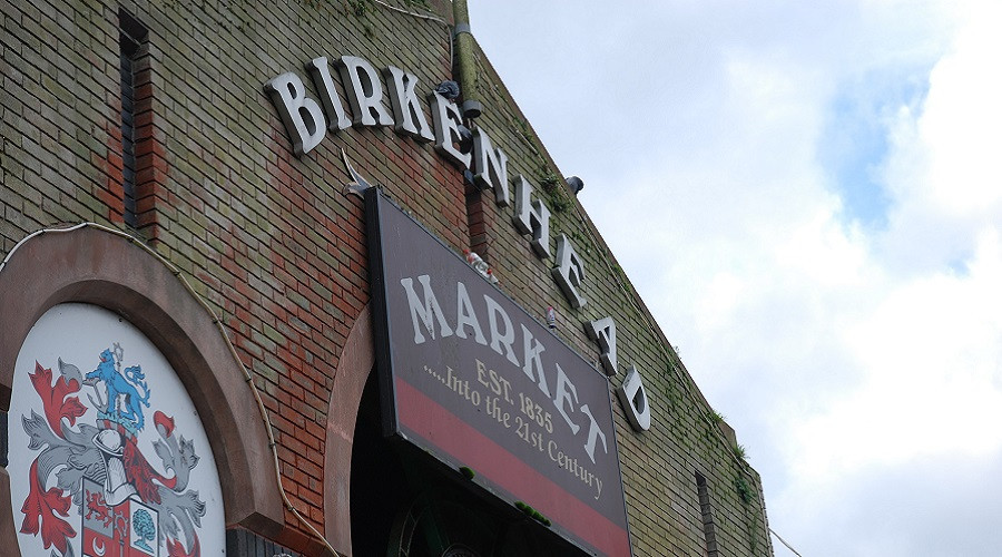 Birkenhead Market exterior showing market sign