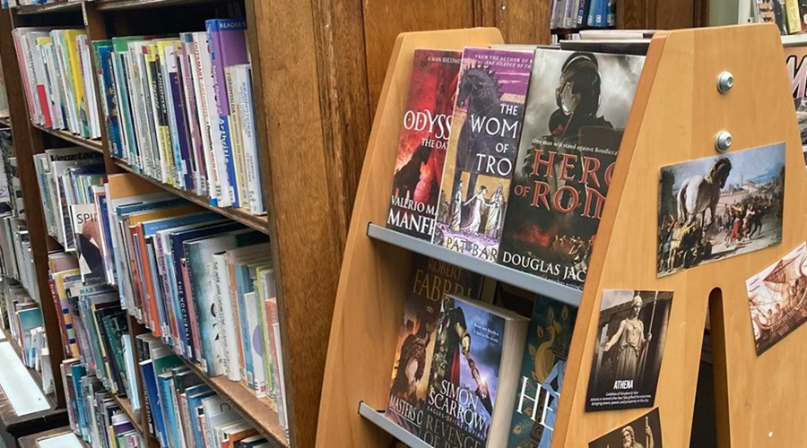 An image from a Wirral library showing books on display and on a shelf