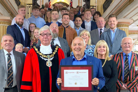 Mayor of Wirral at the front with representatives from Caldy Rugby Club, taken on the staircase at Wallasey Town Hall