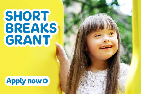 Caption 'short breaks grant' in blue on yellow background, with stock image of smiling young girl