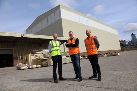 Left to Right: Richard Mawdsley, Director for Development at Peel L&P’s Wirral Waters Dave Dargan, Managing Director, Starship Group Karl Venture, Managing Director, Starship Modular in front of the Mobil building