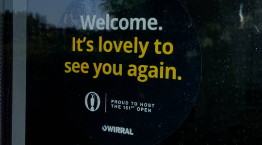 Black window sticker in a local business with text: Welcome, it's lovely to see you again