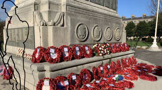 A photo of part of the Cenotaph in Birkenhead covered in red poppy wreaths following the Remembrance Sunday service.