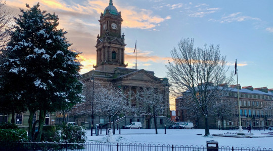 Birkenhead Town Hall and hamilton square with snowfall and blue sky