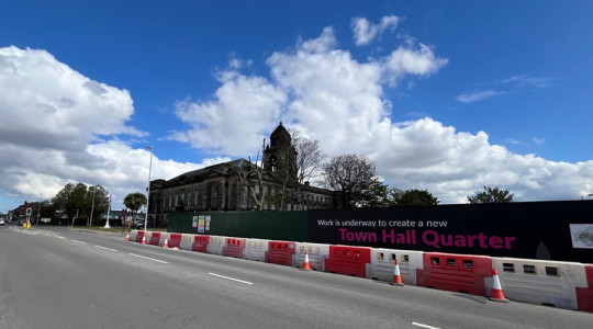 Wallasey town hall with hoardings around sites where South and North Annexes were, following demolition of the annexes, April; 2024
