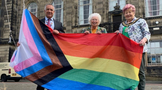 Chief Executive and Mayor of Wirral raise the progress pride flag