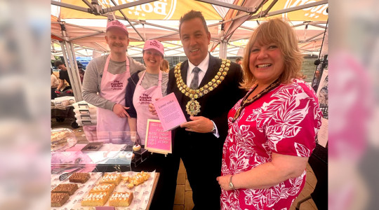 Photo showing The Possible Kitchen from Wirral Youth Market being congratulated by the Mayor and Mayoress of Bolton