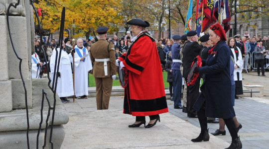 Photo of the Mayor laying a poppy wreath at the Cenotaph