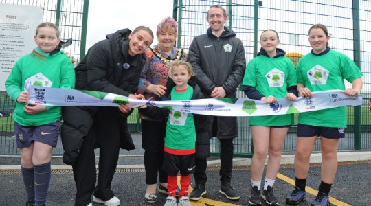 Niamh Charlies cutting the ribbon to unveil new pitch