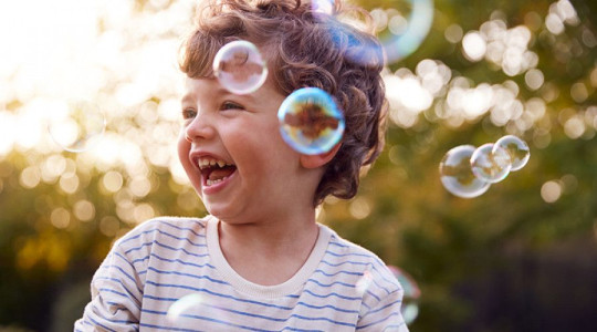 Young child with soap bubbles