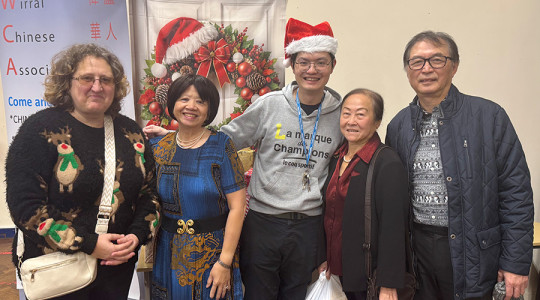 picture of 5 people smiling to camera