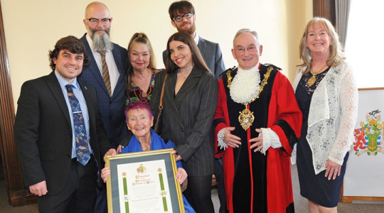 The Mayor of Wirral pictured with members of the Dean family with the scroll honouring Dixie Dean with the Freedom of Wirral