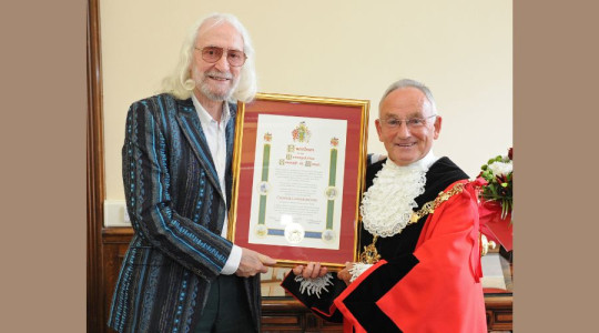 Photo of the Mayor presenting the Freedom scroll to Charlie