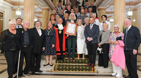 Photo of guests assembled on the staircase at Wallasey Town Hall
