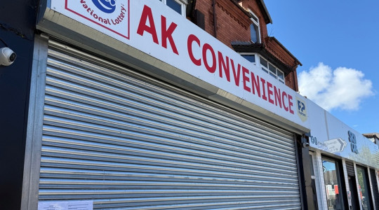 A photos showing the outside of AK Convenience