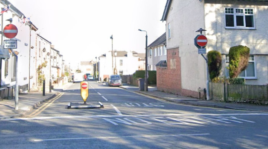 A photo showing the entrance to Village Road, Bebington from its junction with Mount Road