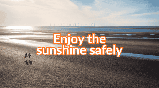 Photo of a sunny beach with the words: Enjoy the sunshine safely