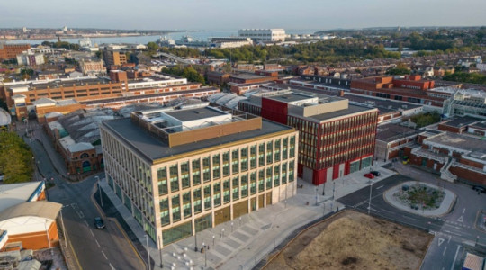 The council's flagship office buildings, Mallory and Irvine, shown from above with Birkenhead's waterfront in the background