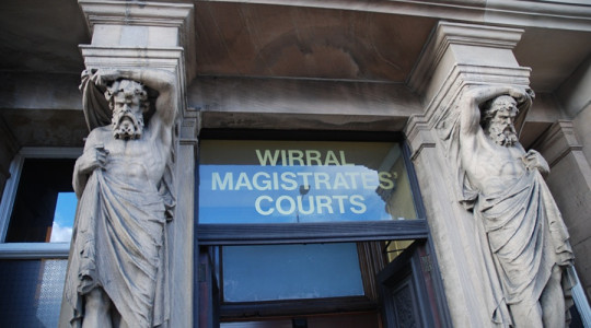 A stock image showing the sign above the door of Wirral Magistrates Court