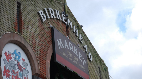 Birkenhead Market exterior showing market sign