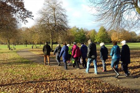 Group of people walking in park 
