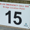 New location signage on motorway bridge