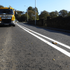 A road laid with Hot Rolled Asphalt has new lines painted on