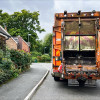 A bin collection lorry in a residential street