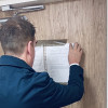 An officer from the anti-social behaviour team serving the Closure Order