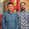 Picture of two men smiling to camera