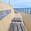 An example of a plaque on the flood wall at West Kirby