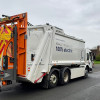 The electric-powered bin lorry being trialled is pictured in action in Woodchurch