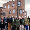Group photo outside one of the new completed apartment  blocks in New Ferry