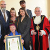 The Mayor of Wirral pictured with members of the Dean family with the scroll honouring Dixie Dean with the Freedom of Wirral