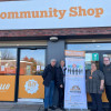 David and ReachOut staff are pictured standing in front of a pop up banner outside the Beechwood Community Shop