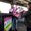 A stock image of a dad and daughter disposing of old toys at their local recycling centre