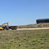 A digger operating on Hoylake beach near the RNLI station