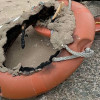 Fire-damaged life rings left behind on a beach in Wirral after being vandalised