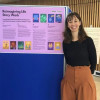 Woman standing beside display that shows a project around Life Story cards
