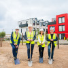 From left, each wearing PPE and holding a spade: Cllr Mark Skillicorn, James Wittaker, Lisa Forshaw and Lyndon Forshaw. Image courtesy of Peel Waters