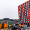 Sainsburys Local store at Wirral Waters with Millers Quay in the background