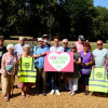 Cllr Max Booth pictured with volunteers from the Friends group at Mayer Park in Bebington